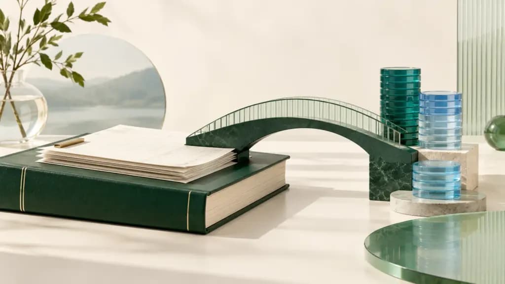 A forest-green ledger, invoice sheets and glass coin stacks connected by a reconciliation bridge